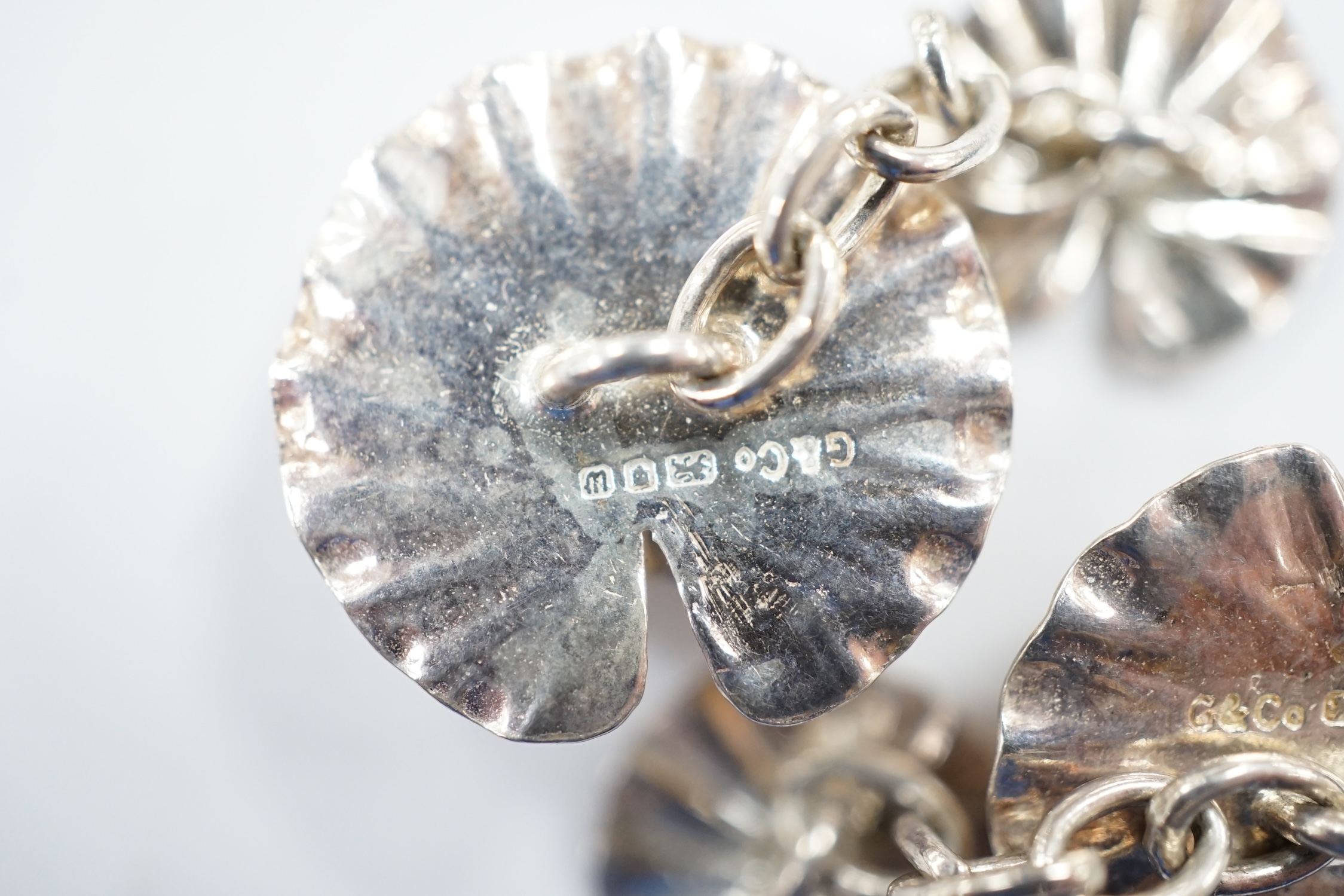 A modern pair of silver 'frog on lily pad' cufflinks, London, 1996, 17mm.